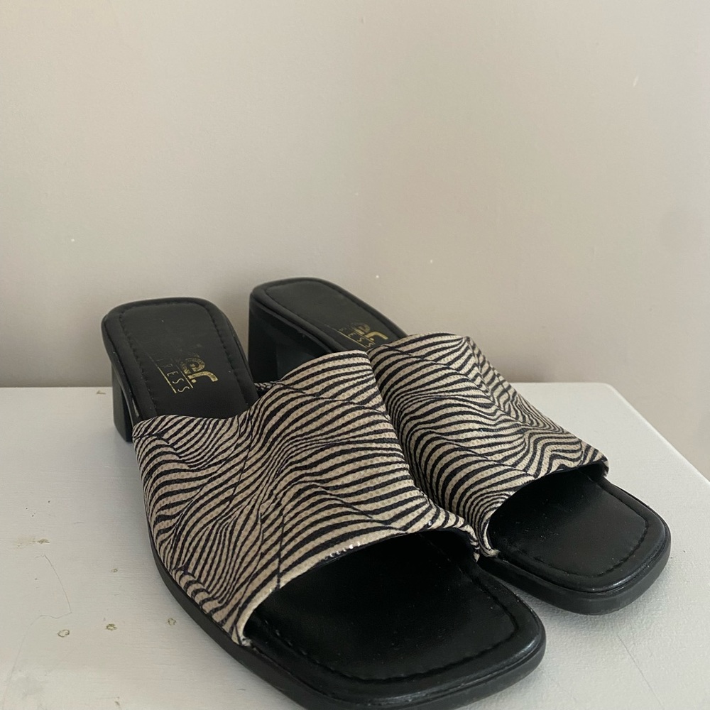 90’s/Y2K sip on sparkly heeled sandals.
